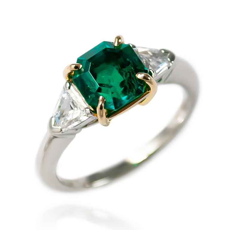 This beautiful and mesmerizing ring from the J. Birnbach workshop features an AGL certified 1.84 ct Colombian Emerald flanked with modified bullet side stones = 0.44 ctw of E-F color and VS clarity . Edgy in execution and timeless looking, this