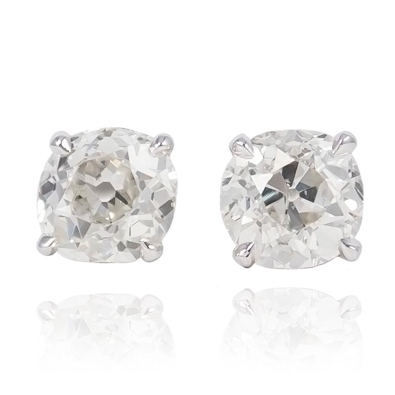 These studs feature two antique, cushion cut diamonds = 2.31 ctw set in 18K White Gold settings with heavy duty friction backs. Easily be dressed up or down for everyday wear, these earrings make for the perfect holiday gift item!

