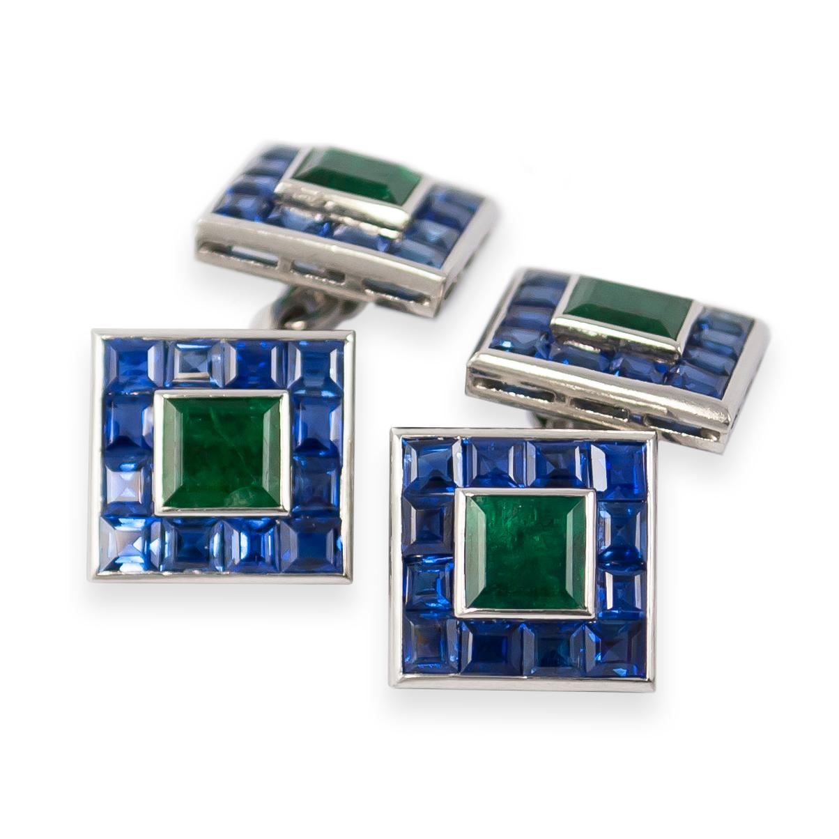 This exquisite cuff link and stud set are a one-of-a kind execution from the Art Deco era! Featuring 96 carre cut sapphires and seven, square, emeralds = 4.00 carat total weight, these flexible cuff links are essence of sophisticated.
With hand-cut