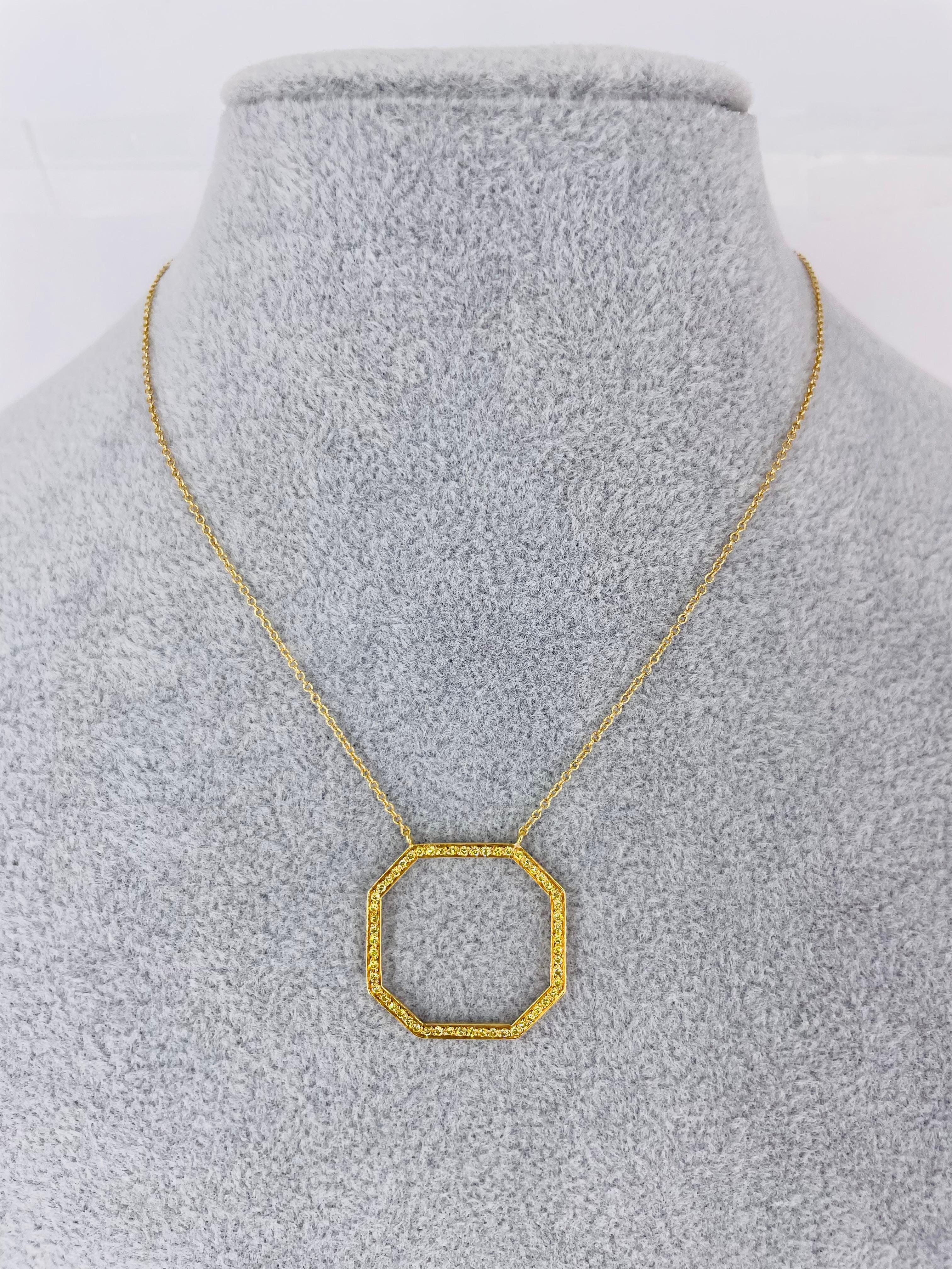This sophisticated piece by J. Birnbach is a sleek outline of an octagon with 0.18ctw fancy intense yellow diamonds. The octagon pendant is attached to the chain so it will always lay flat and straight on the wearer. The pendant and chain are