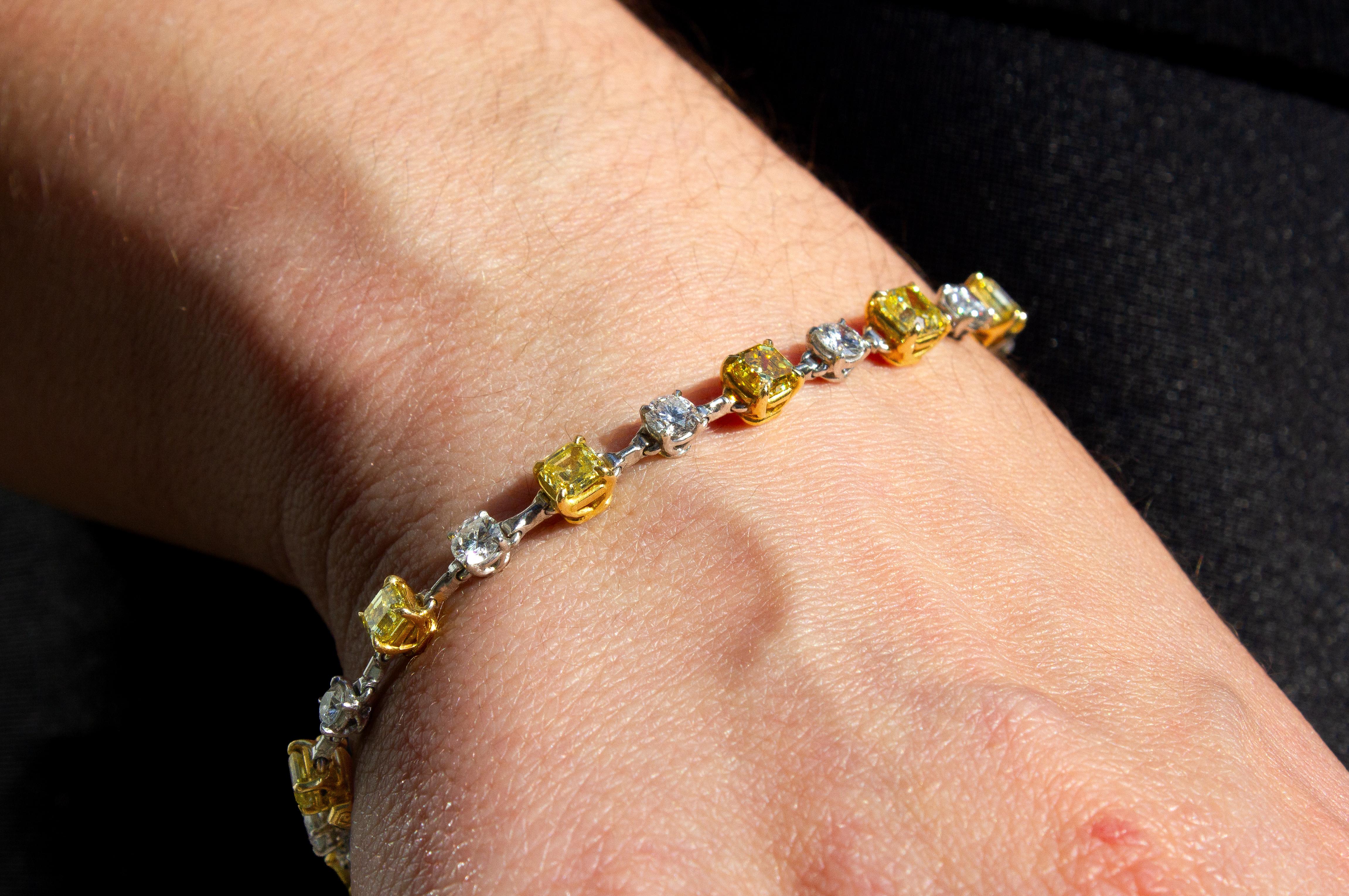 This exceptional yellow and white diamond bracelet by J. Birnbach is a striking fusion of color and brilliance, offering a sophisticated way to incorporate fancy yellow diamonds into your collection. The design features 6.18 carats of fancy intense