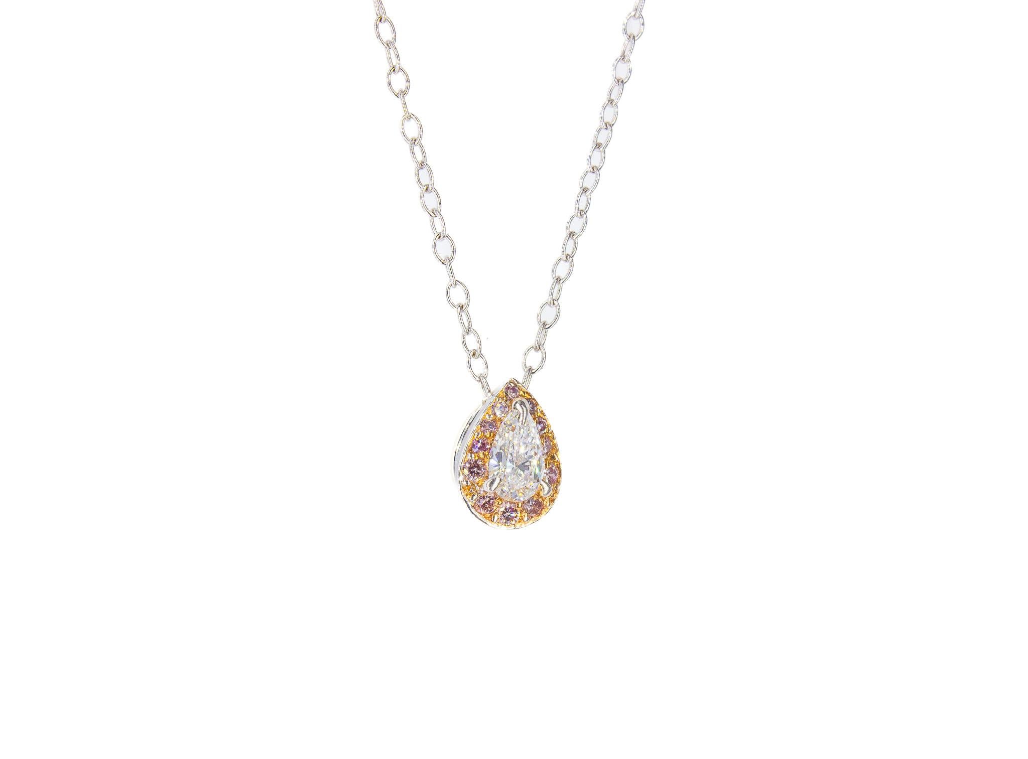 Elevate your collection with this exquisite 18K Two-Tone Pendant Necklace. Showcasing a delicate 0.25 carat pear-shaped diamond, this stunning piece is enhanced by 0.15 carats of fancy pink pavé-set diamonds, creating a breathtaking halo that