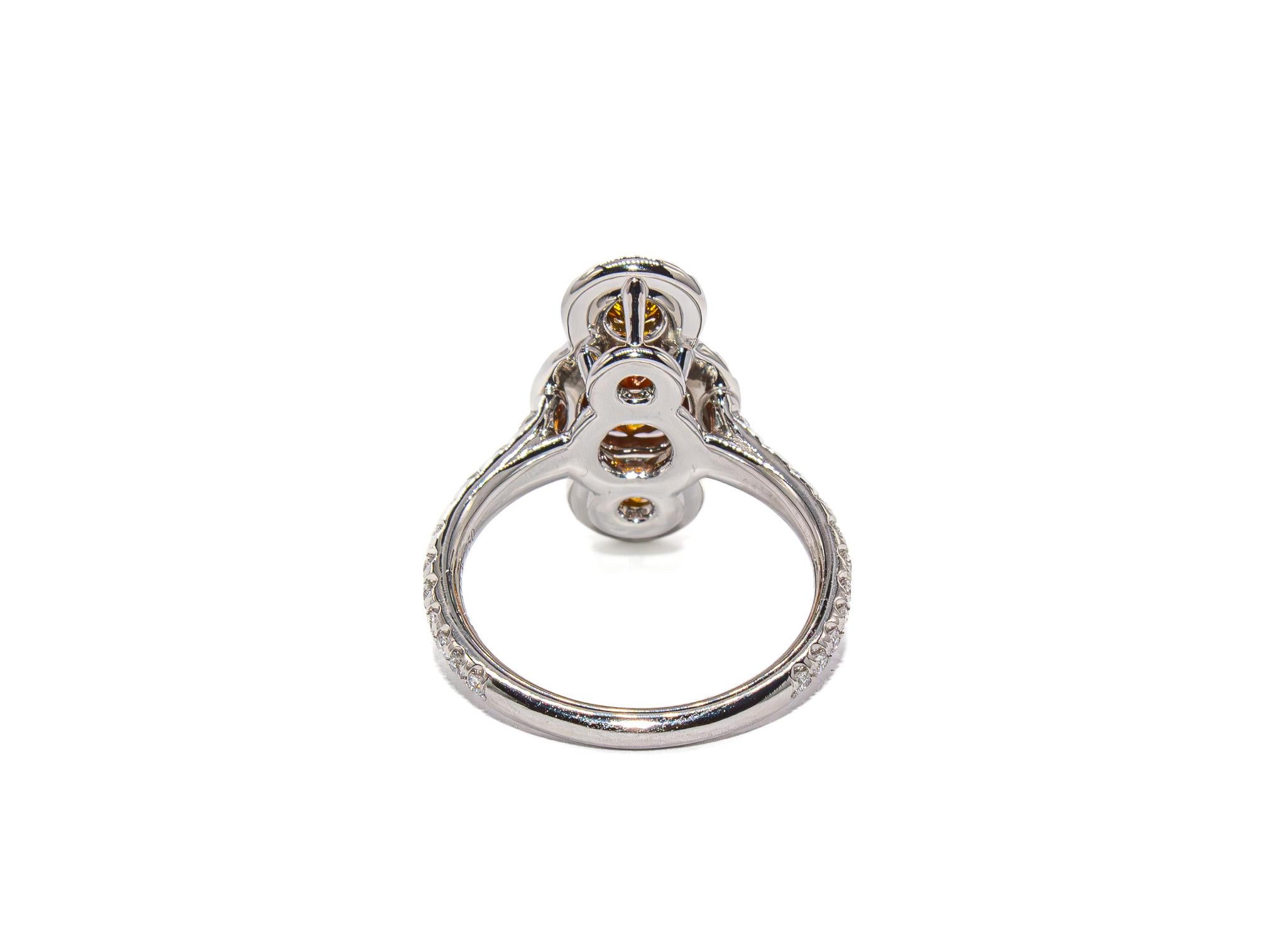 J. Birnbach GIA 1.22 Carat Total Fancy Orangy Brown Diamond Three-Stone Ring Corte redondo en venta