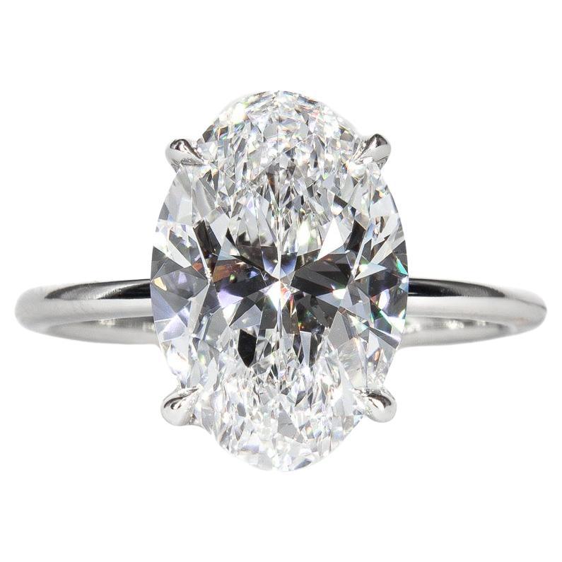 J. Birnbach GIA 3.82 Carat D SI1 Oval Diamond and Sapphire Three-Stone Ring