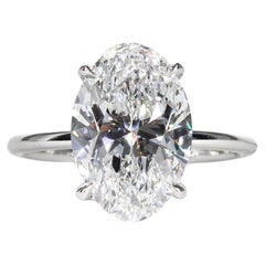 J. Birnbach GIA 3.82 Carat D SI1 Oval Diamond and Sapphire Three-Stone Ring