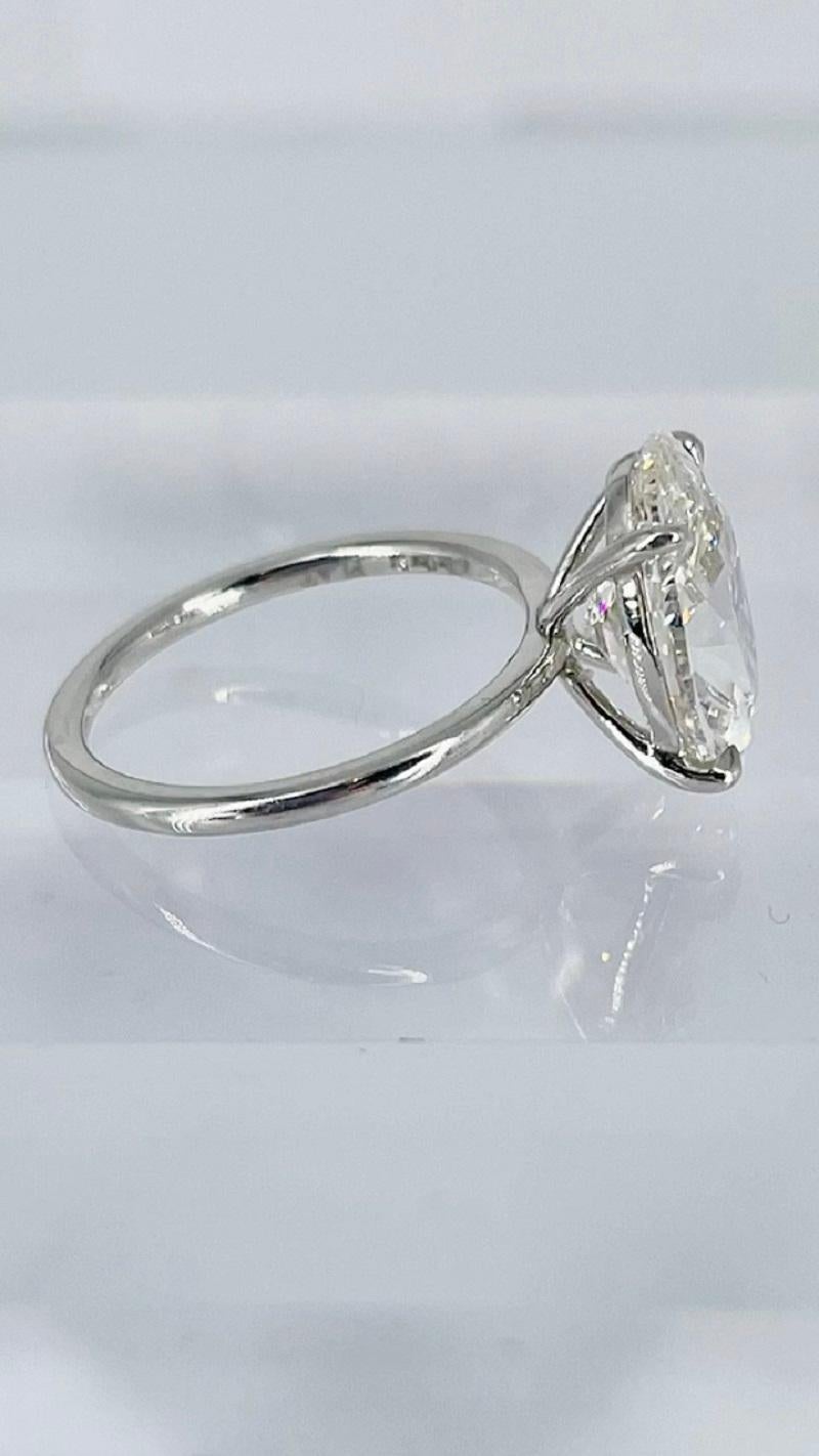 This timeless engagement ring by J. Birnbach features a GIA certified 4.02 carat oval diamond of J color and VVS2 clarity, as described by report #6223170392. A simple and sophisticated look, the diamond appears to be floating on your finger. The