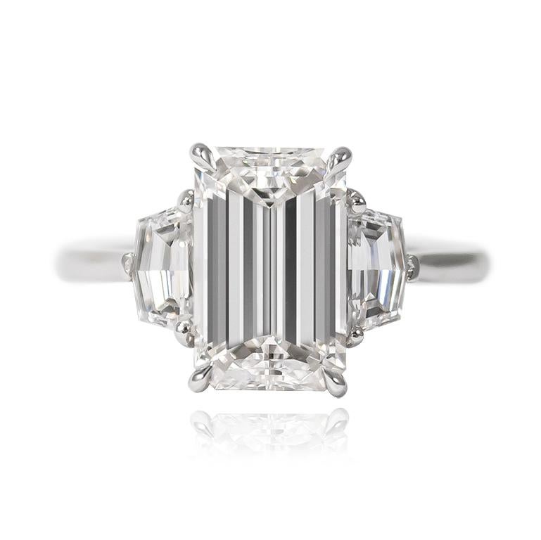 This fierce and edgy execution of a timeless classic is simply beyond description! A new favorite of the J. Birnbach family, this ring features a scintillating 3.00 ct Emerald cut diamond of E color and VS2 clarity. Set with a pair of epaulette