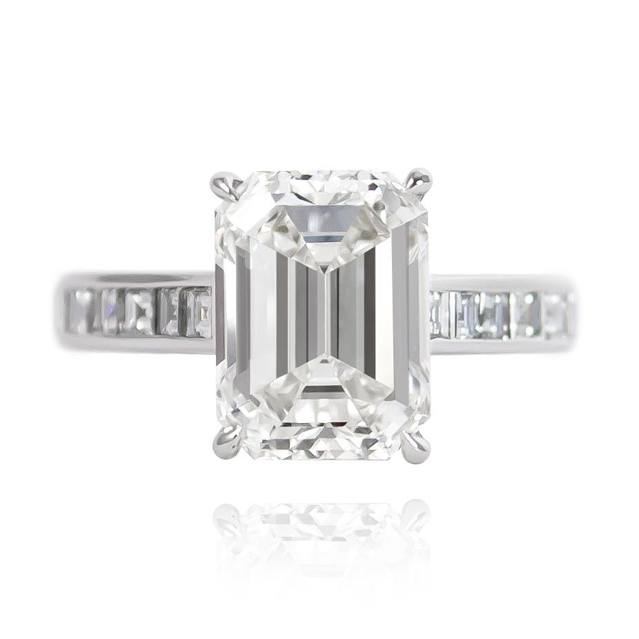 This breathtaking ring features a GIA certified 4.08 ct Emerald cut diamond of I color and VS1 clarity. Set in a handmade, platinum ring with 20 carres = 1.08 ctw, this piece is mesmerizing from every angle! 

Purchase includes complimentary ring