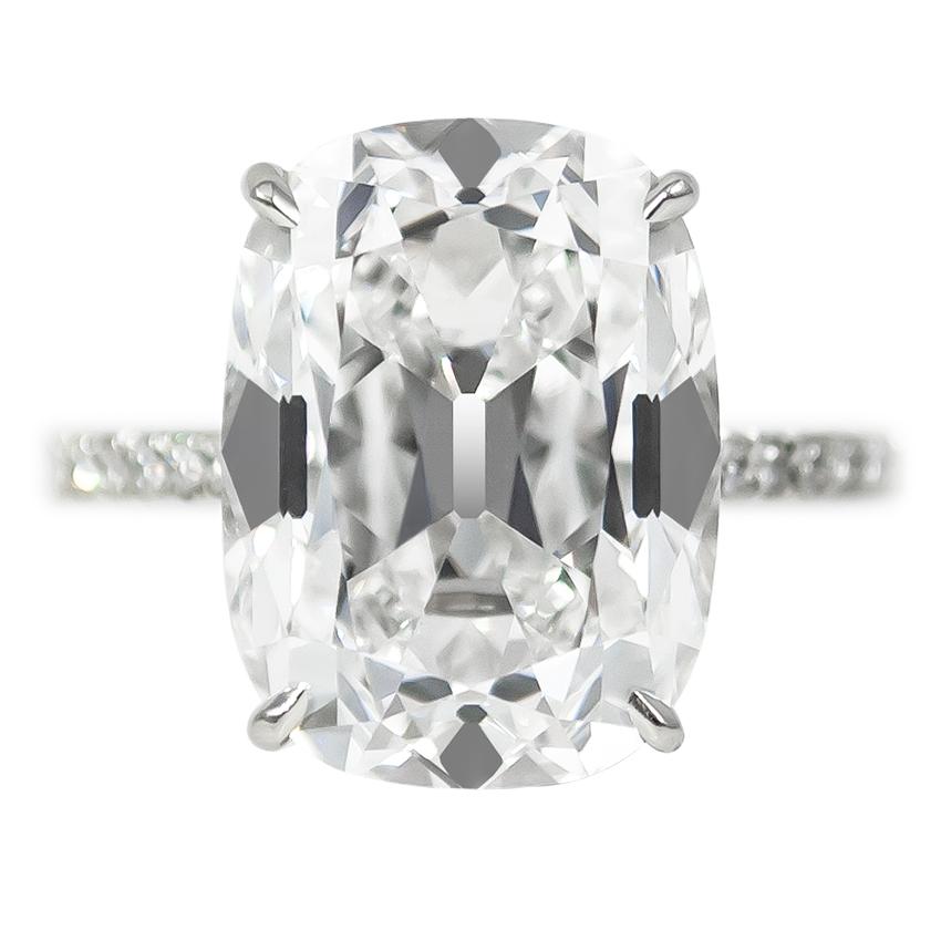 This gorgeous 10.01 ct Cushion Brilliant diamond of E color and VS2 clarity is a once-in-a-lifetime stone! Set in a fine, handmade platinum ring with brilliant round pavé details = 0.48 ctw. Charming and sophisticated, the distinct, hand-cut