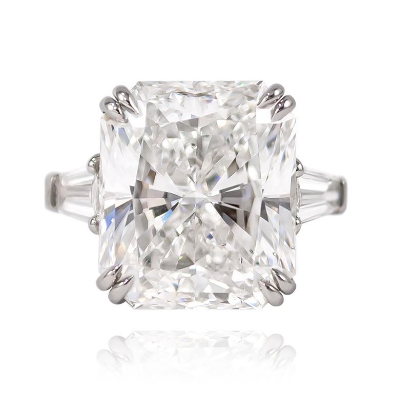 This jaw-dropping, handmade ring features a 10.02 carat Radiant cut diamond of D color and SI1 clarity. Set in platinum with tapered baguettes = 1.10 ctw (approximately), this piece is the essence of sophisticated. 

Purchase includes complimentary