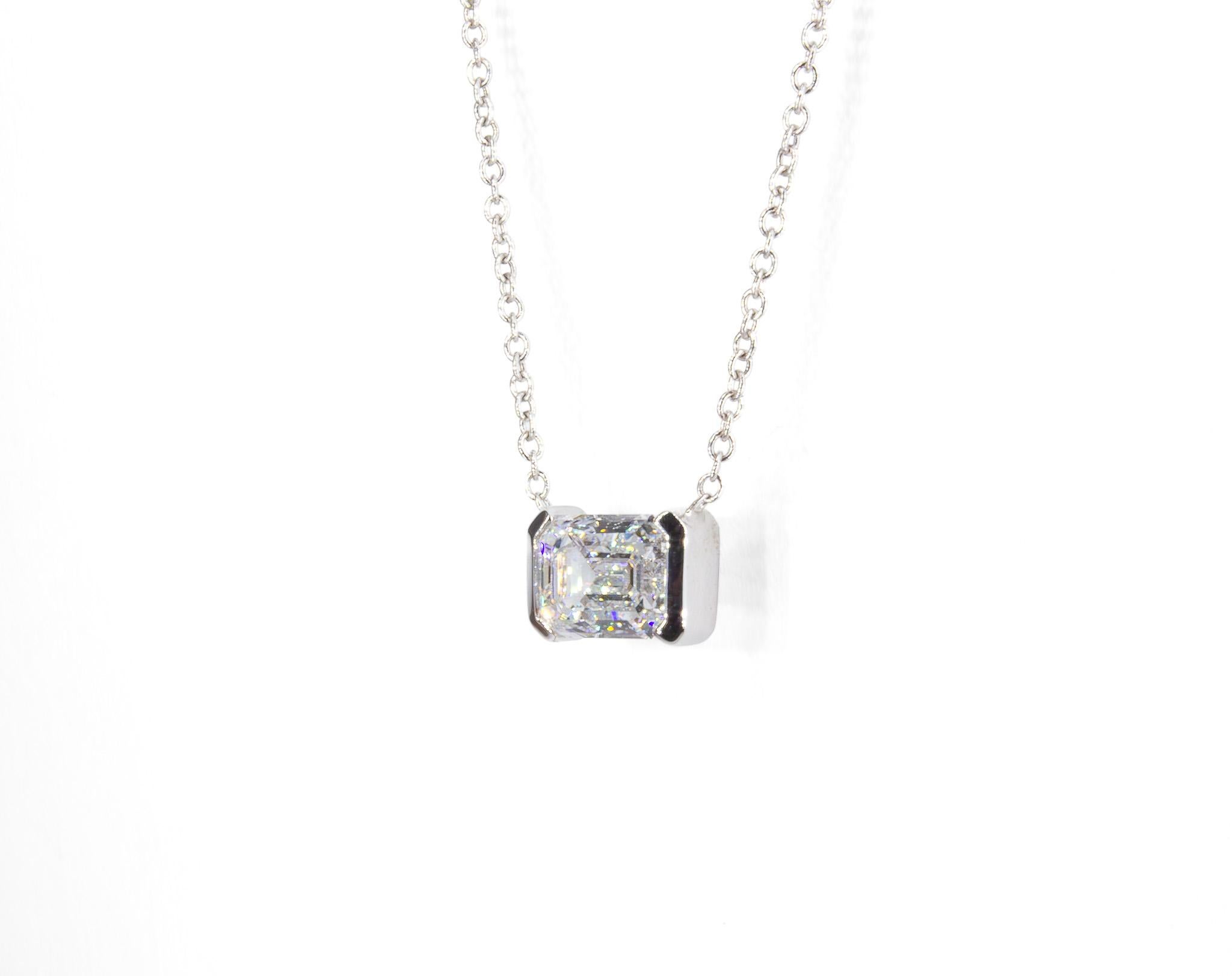 Refined and timeless, this GIA Certified 1.01 Carat Emerald Cut Diamond Solitaire Necklace exudes understated elegance. The centerpiece of this necklace is a stunning 1.01 carat emerald cut diamond, GIA certified with D color and SI2 clarity,