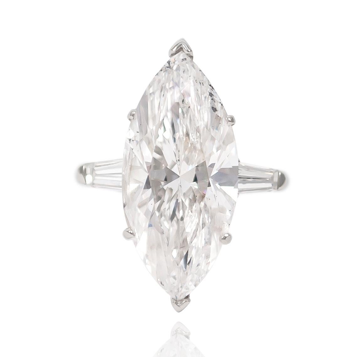 This incredible GIA certified 10.35 ct Marquise diamond is set in a handmade platinum setting with a pair of tapered baguettes = approximately 0.50 ctw. 

Purchase includes complimentary ring sizing and original GIA Certificate No. 1192462221 which