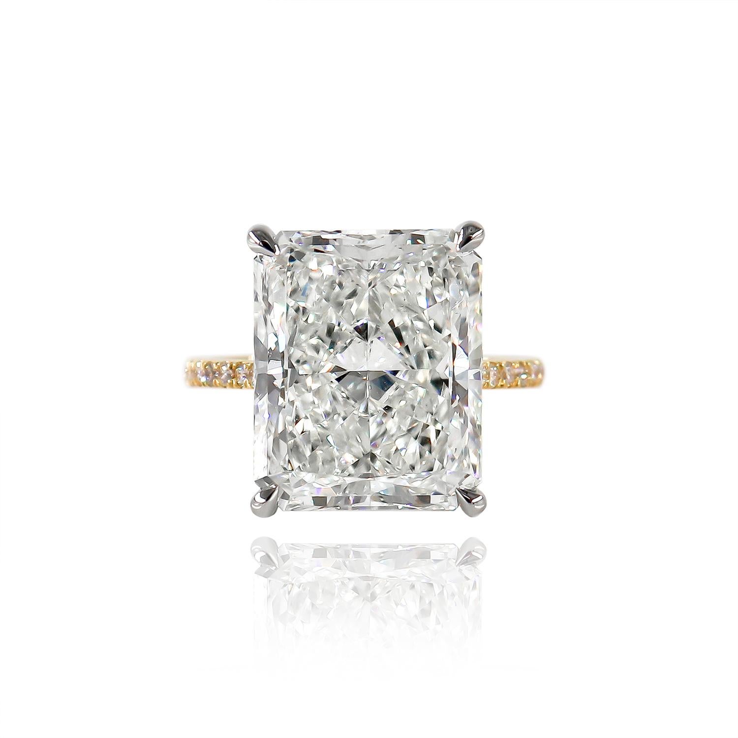 This exquisite sparkler fresh from the J. Birnbach workshop features a GIA certified 11.41 carat radiant cut diamond of J color and VS2 clarity as described by GIA grading report #6227239742. Set in a platinum and 18K yellow gold ring with brilliant