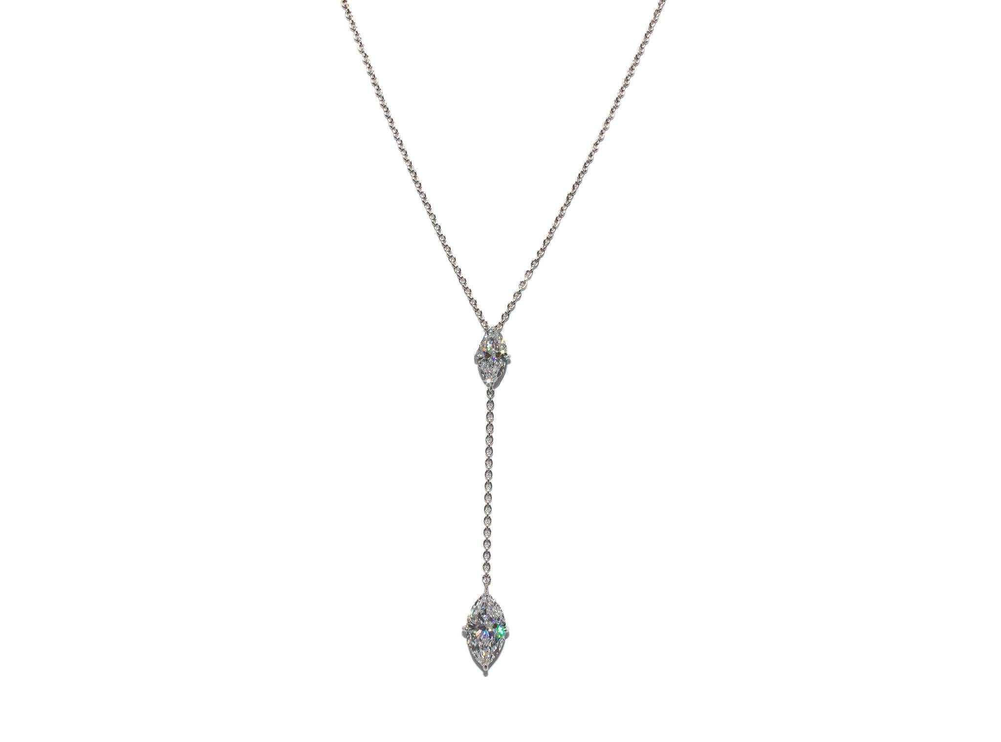 This elegant J. Birnbach 18K white gold lariat-style necklace is a captivating blend of timeless design and contemporary flair. The centerpiece features a dazzling 1.01 carat marquise-cut diamond, GIA certified with a rare D color and I1 clarity.