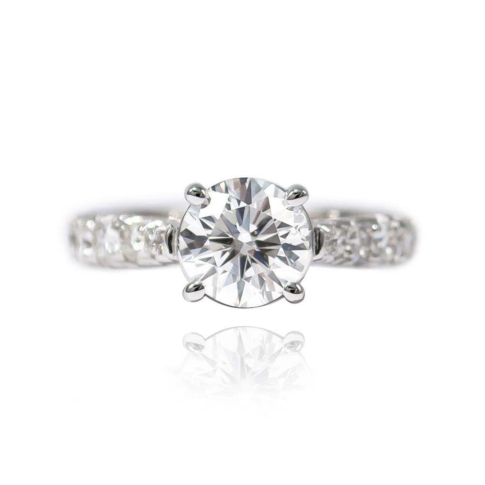 This beautiful classic from the J. Birnbach vault features a 1.52 carat Brilliant Round diamond of E color and I1 clarity... The stone is set in a handmade, 18K White Gold Pavé Ring with 14 Brilliant Rounds = 0.75 ctw. 

Purchase includes