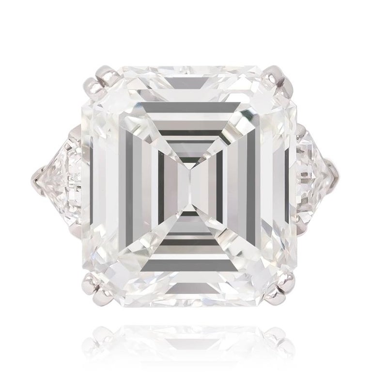 This exceptional piece from the vaults of J. Birnbach is a true treasure... The handmade platinum ring features an incredible GIA Certified 18.04 ct G VS2 Emerald cut diamond with two triangular side stones = 1.50 ctw. 

Purchase includes original