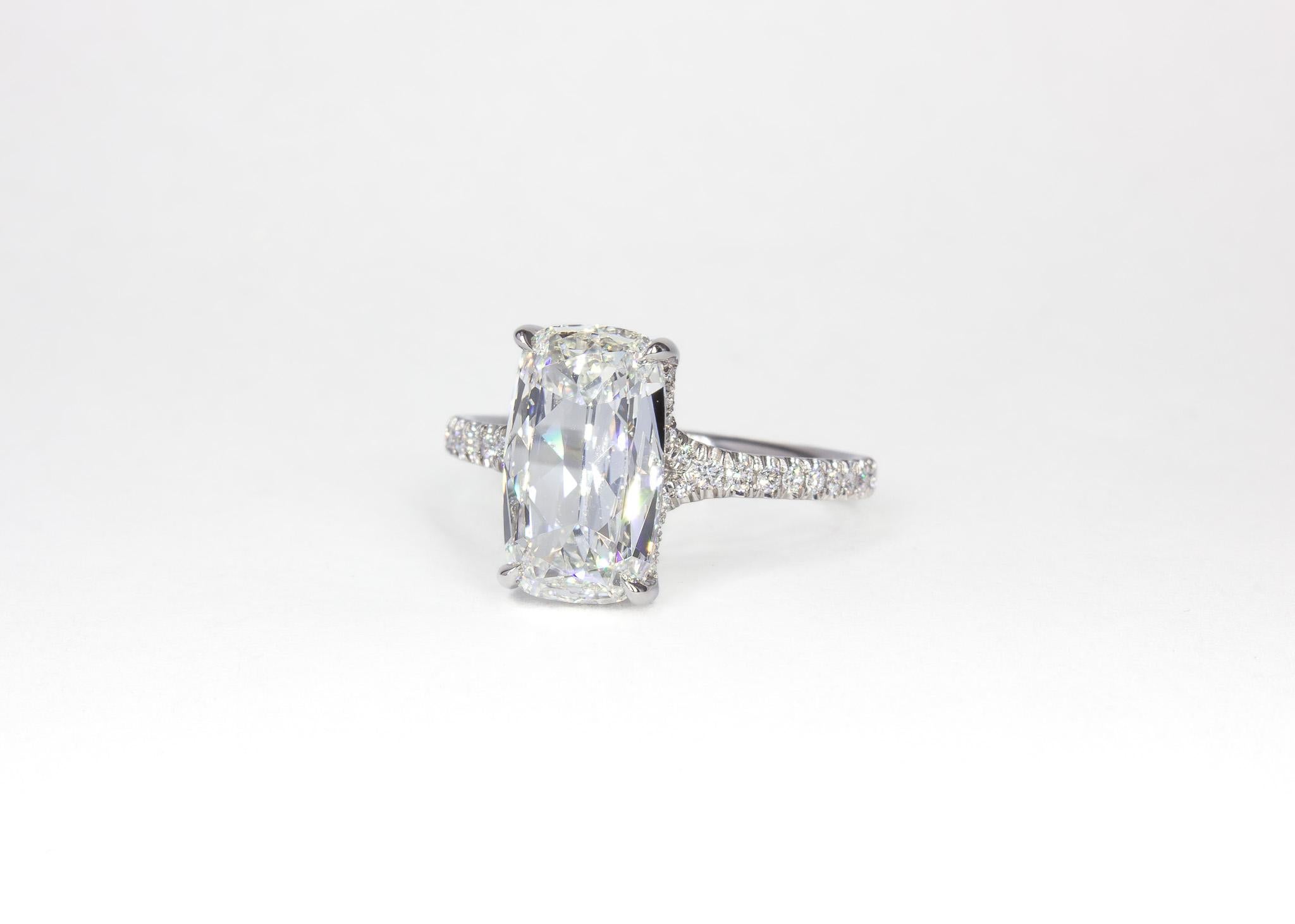 This elegant platinum solitaire ring is a timeless expression of sophistication and grace. Featuring a stunning 2.01 carat cushion brilliant diamond, GIA-certified with a G color and SI1 clarity, the center stone radiates brilliance and fire.