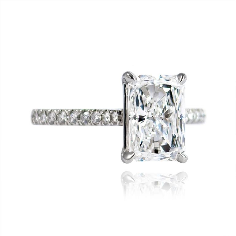 This scintillating stunner by J. Birnbach features a certified 2.08 carat radiant cut diamond of D color and VS1 clarity as described by GIA grading report #2171920456. Set in a handmade, platinum ring with 24 pavé set, round, brilliant-cut diamonds