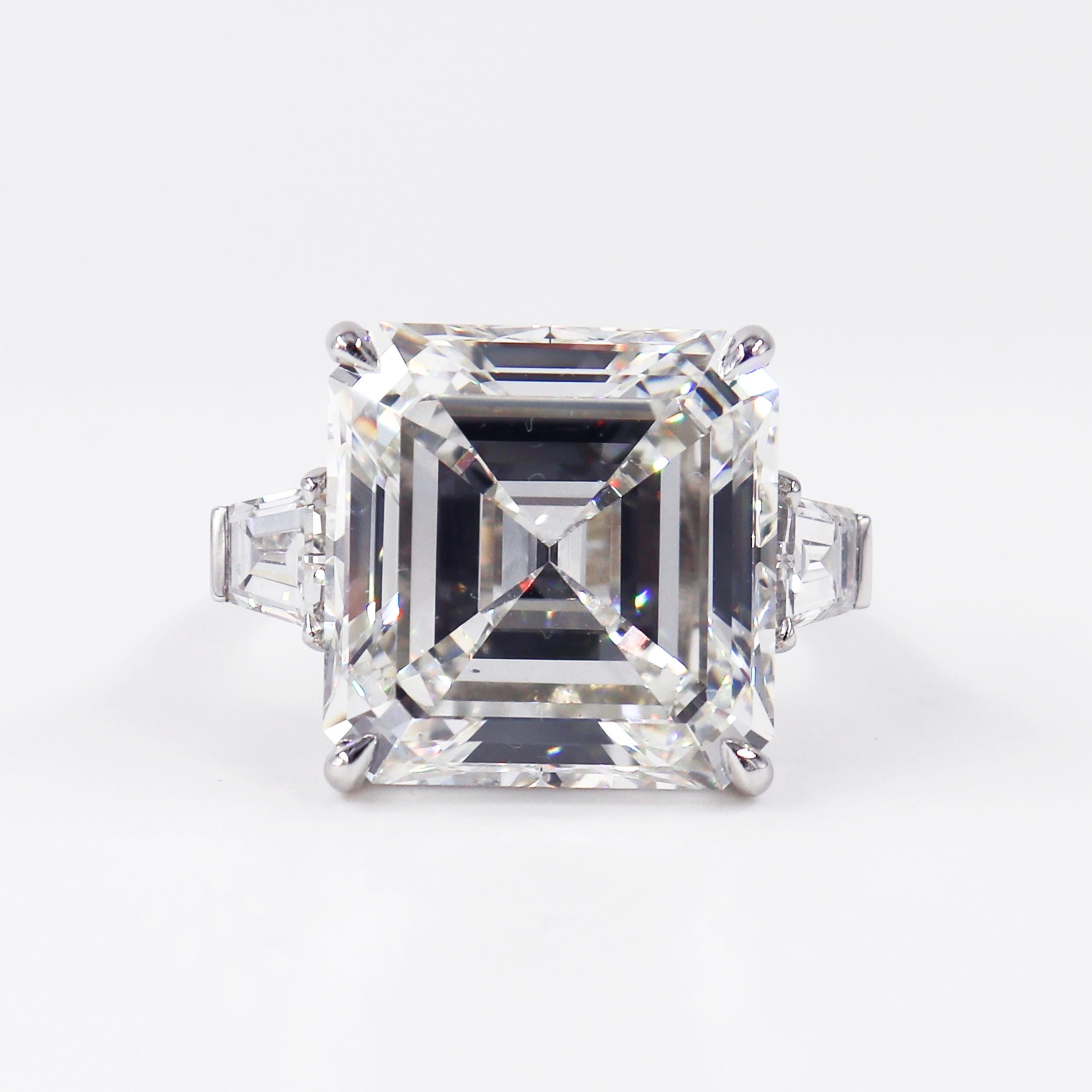 A truly spectacular piece featuring a treasure from the J. Birnbach vault. This magnificent ring features a 21.13 carat GIA certified Asscher cut of H color and VS1 clarity. Tapered baguettes are a timeless accent to the center diamond-this pair