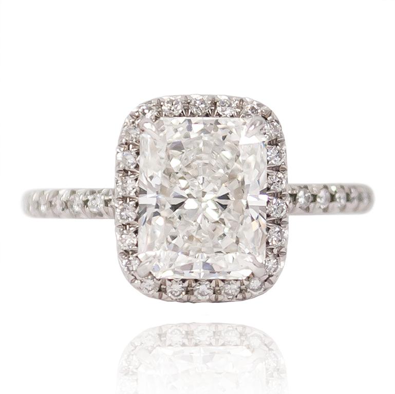 This incredible J. Birnbach original features a GIA Certified 2.40 ct Radiant cut F SI1 diamond set in a handmade, cellini style halo mounting. Sparkling and sophisticated in every way, the ring has 46 brilliant round diamonds = 0.30 ctw. 

The
