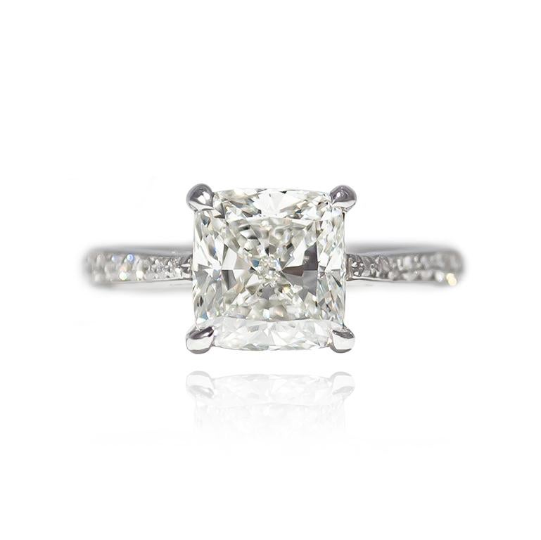 This scintillating stunner will be the envy of all your friends! Featuring a GIA certified 2.51 ct Cushion cut diamond of G color and VS2 clarity, this handmade, platinum ring has a vintage flair with bright cut pavé details = 0.35 ctw