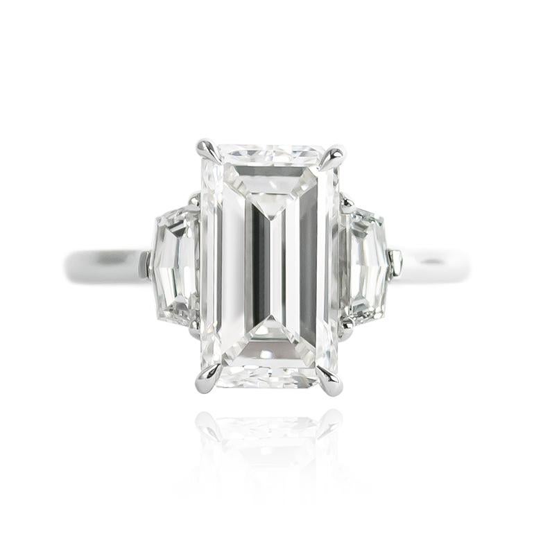 This new J. Birnbach ring features a 3.02 ct Emerald cut diamond of G color and VS1 clarity... Set in a handmade, platinum three-stone ring with epaulette side stones = 0.59 ctw, this piece is breathtaking from every angle! 

Purchase includes