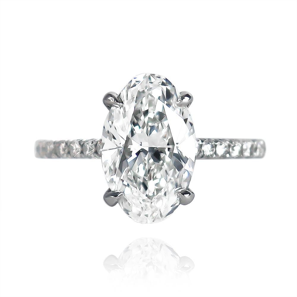 This scintillating and romantic ring from the J. Birnbach collection features a 2.92 carat oval brilliant cut diamond of G color and SI1 clarity. 100% eye-clean with an elongated outline that flatters the finger, this diamond is set in a handmade,