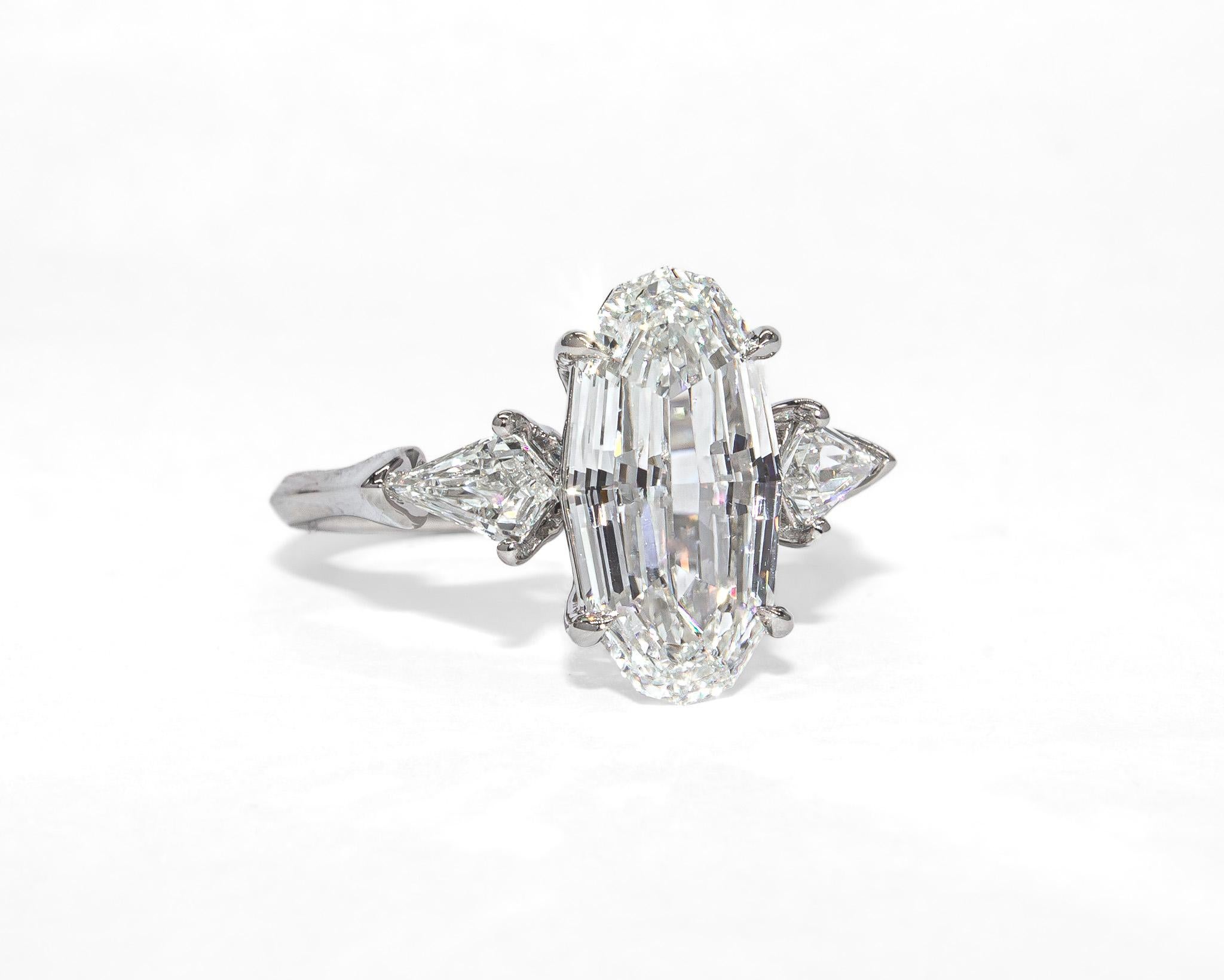 Contemporary J. Birnbach GIA Certified 3.01 Carat Oval Step Cut Diamond Three-Stone Ring For Sale