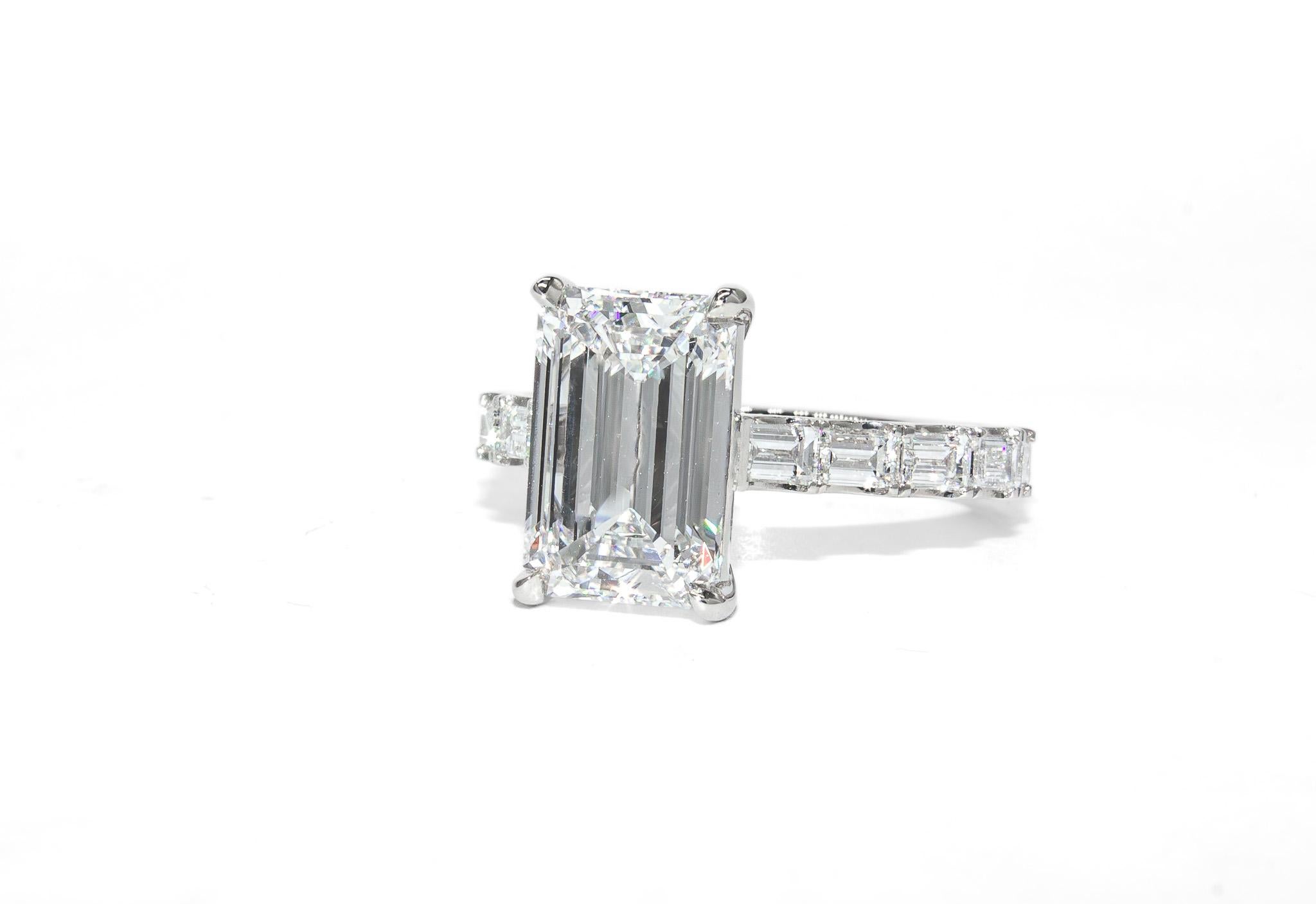 This elegant J. Birnbach platinum ring showcases a breathtaking 3.05 carat emerald-cut diamond, GIA certified with F color and VS1 clarity. The exceptional center stone boasts remarkable near-colorless brilliance and outstanding clarity, making it a