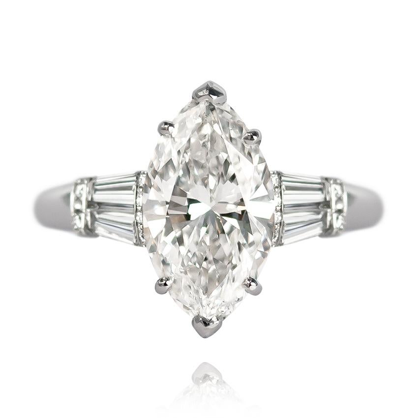 This scintillating 3.13 carat Marquise diamond of H color and SI2 clarity is set in a handmade, platinum mounting with tapered baguettes = 0.54 ctw and brilliant round pavé details = 0.14 ctw. As a piece that's beyond flattering on the finger, this