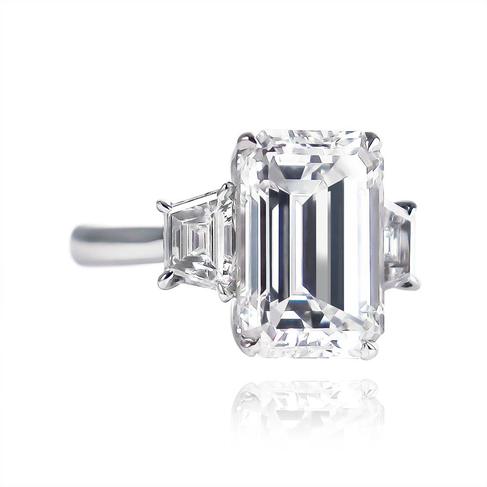 This sleek and elegant engagement ring by J. Birnbach is a modern take on a classic design. The ring features a 3.50 carat emerald cut diamond, certified by GIA to be E color and VVS2 clarity. What makes this ring so special is the narrow and