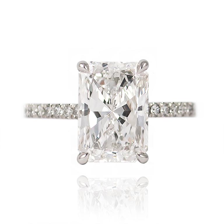 This breathtaking ring features a GIA Certified 4.02 ct Radiant cut diamond set in a platinum mounting with pavé details cascading three-quarters of the way down the ring shank. 

Purchase includes original GIA Certificate No. 2191066665 which