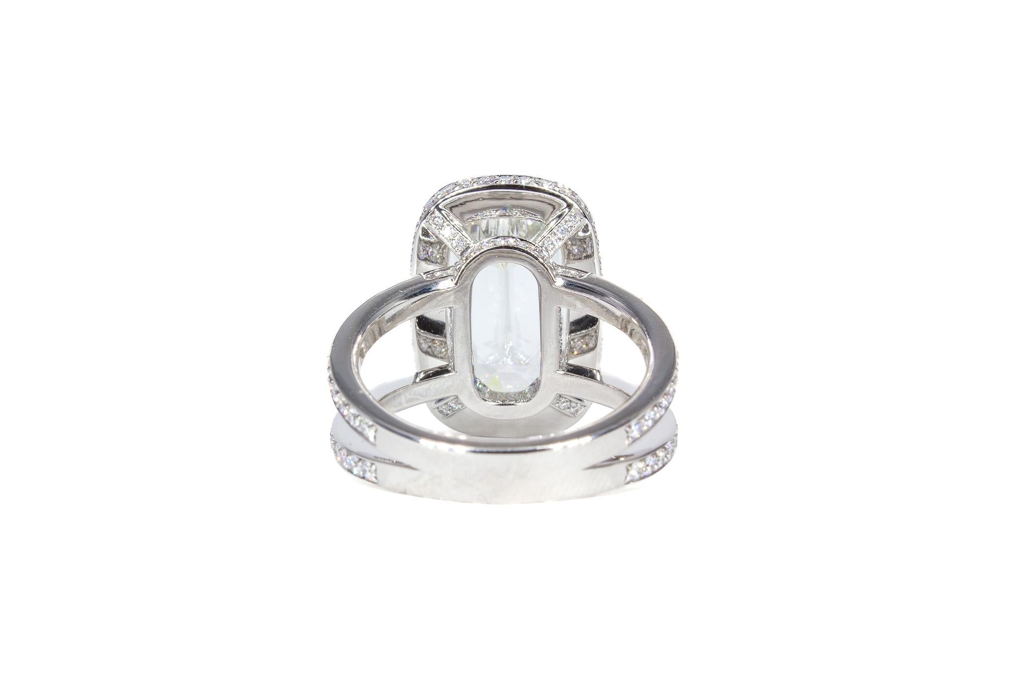 Elevate your jewelry collection with this stunning platinum halo ring, featuring a captivating Ashoka-style elongated cushion-cut diamond. The GIA-certified 4.03 carat center diamond, graded I color and VS2 clarity, is elegantly framed by a