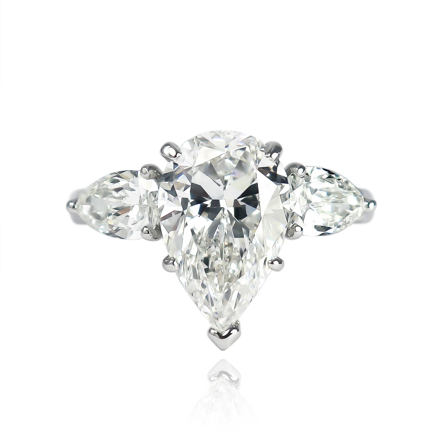 This bold, three-stone ring from the J. Birnbach vault features a GIA certified 4.03 carat pear brilliant cut diamond of G color and VS1 clarity as described by GIA grading report #2151107253. With excellent polish and very good symmetry, this