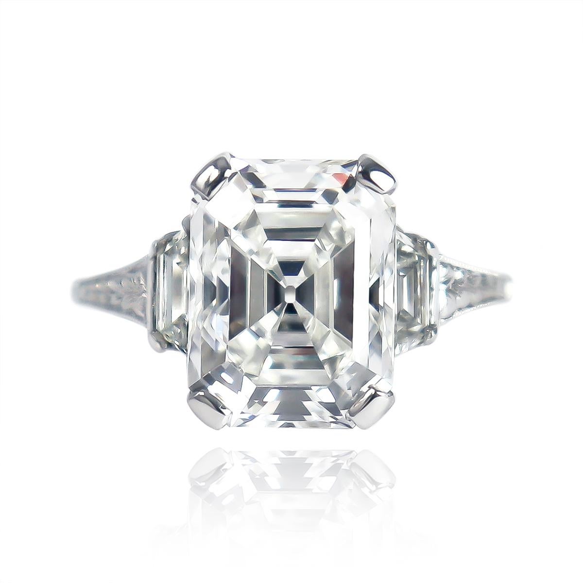 An exceptional, one of a kind piece from the J. Birnbach vault. This exquisite platinum Art Deco ring featuring a 4.07 carat emerald cut diamond is a prime example of the craftsmanship and detail of the period. 

The center diamond is certified by