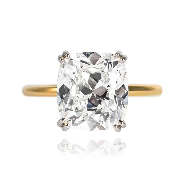 This new, sleek ring from the J. Birnbach workshop features a 4.21 carat Cushion Brilliant cut diamond of H color and VS1 clarity... Charming to the max, this diamond is set in a handmade, platinum and 18K yellow gold solitaire ring with double claw