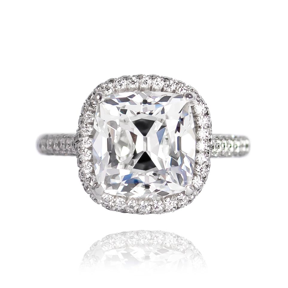 This breathtaking, platinum ring features a GIA certified 4.27 carat Cushion Brilliant cut diamond of G color and VVS2 clarity... Set in a three-sided pavé ring, this piece is a true stand-out! 

Purchase includes complimentary ring sizing, ring