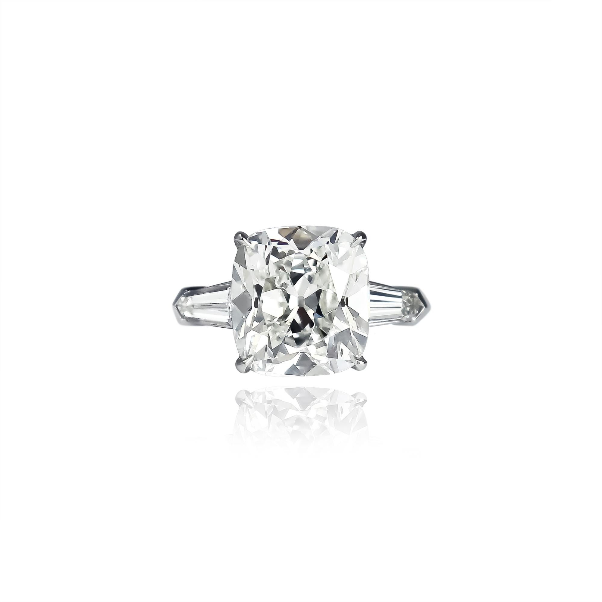 This exquisite ring from the J. Birnbach workshop features a 4.38 carat cushion brilliant cut diamond of H color and VS1 clarity as described by GIA grading report #16204525. The beautifully faceted diamond is set in a handmade, platinum ring with