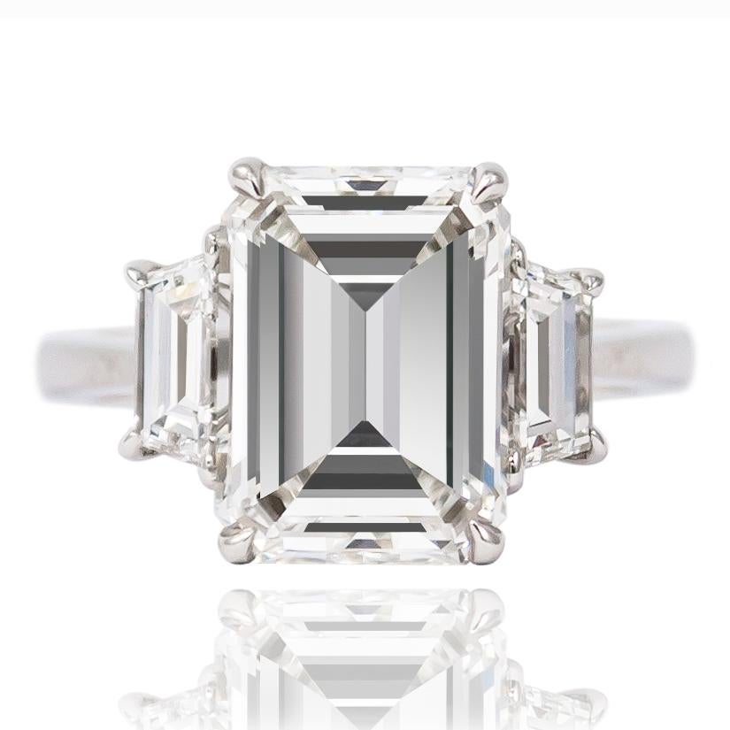 This spectacular platinum ring features a GIA Certified 4.48 ct Emerald cut diamond of H color and VS2 clarity. Flanked by a gorgeous pair of step-cut traps = approximately 0.70 ctw, this ring is guaranteed to be a showstopper! 

Purchase includes
