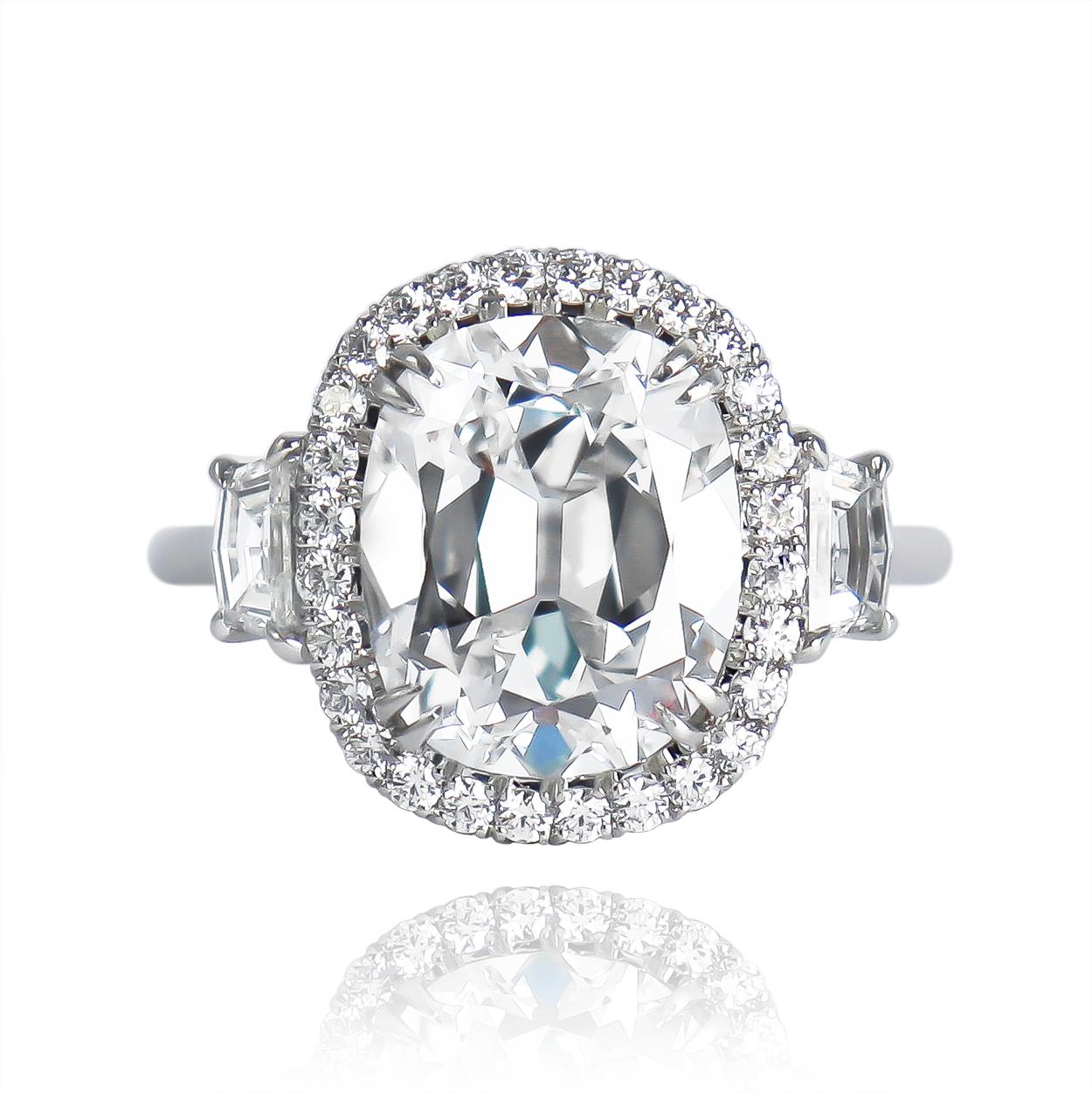 This incredible execution from the J. Birnbach workshop features a scintillating, 5.01 carat cushion brilliant cut diamond of E color and SI1 clarity set in a handmade, platinum ring. The optical properties of this stone are mesmerizing - the