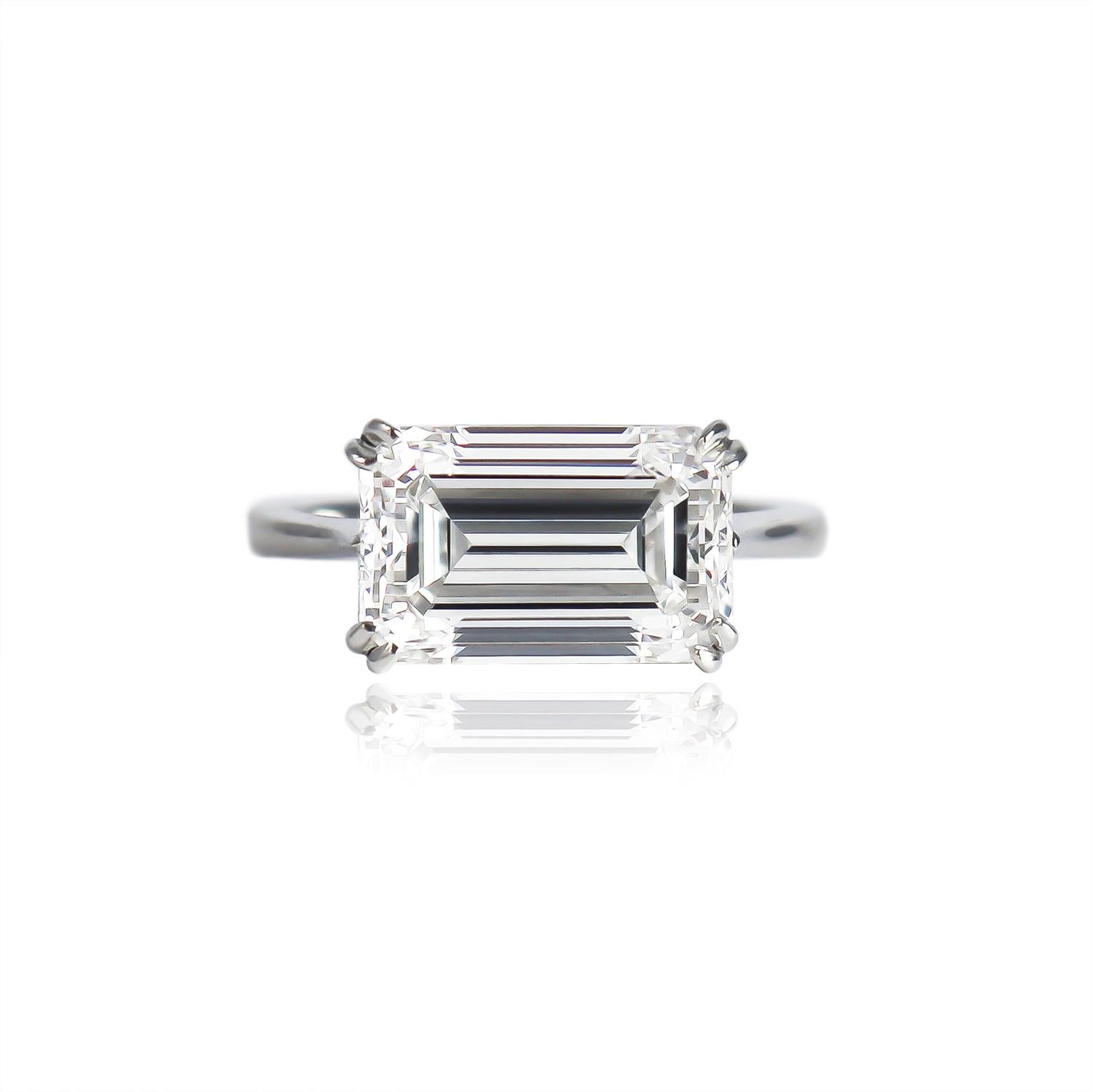 This edgy and breathtaking ring from the J. Birnbach workshop features a 5.01 carat emerald cut diamond of F color and SI1 clarity. With an incredible, 100% eye-clean SI1 clarity grade and an elegant, elongated outline, this charming diamond is set
