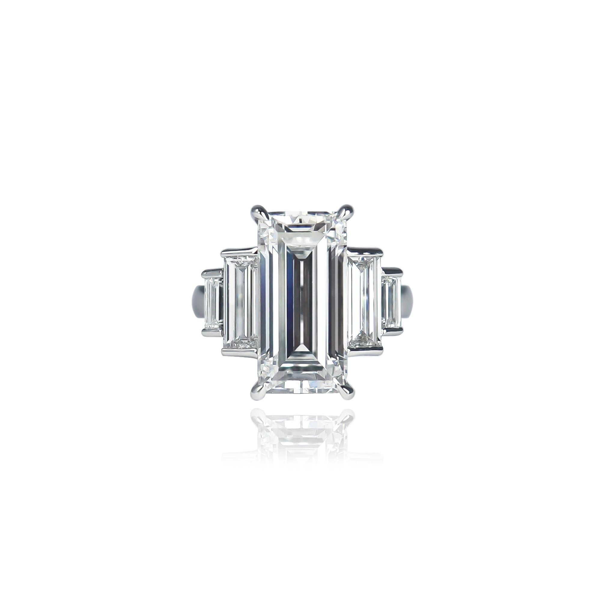 This incredible, new ring from the J. Birnbach workshop features a GIA certified 5.61 carat emerald cut diamond of E color and SI1 clarity. Set in a thoughtfully designed Art Deco style ring with straight baguette diamonds = 1.49 carat total weight,