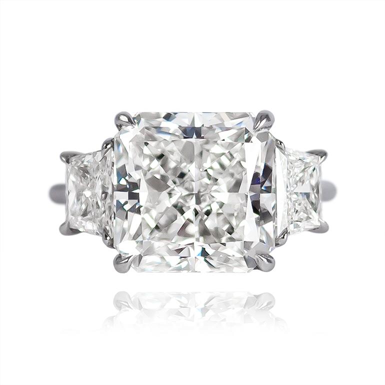 This outstanding 6.58 carat radiant cut diamond engagement ring is perfect for someone looking for sparkle and glamour! The 6.58 carat center diamond is certified by GIA as I color and VS2 clarity. Two brilliant cut trapezoids on either side create