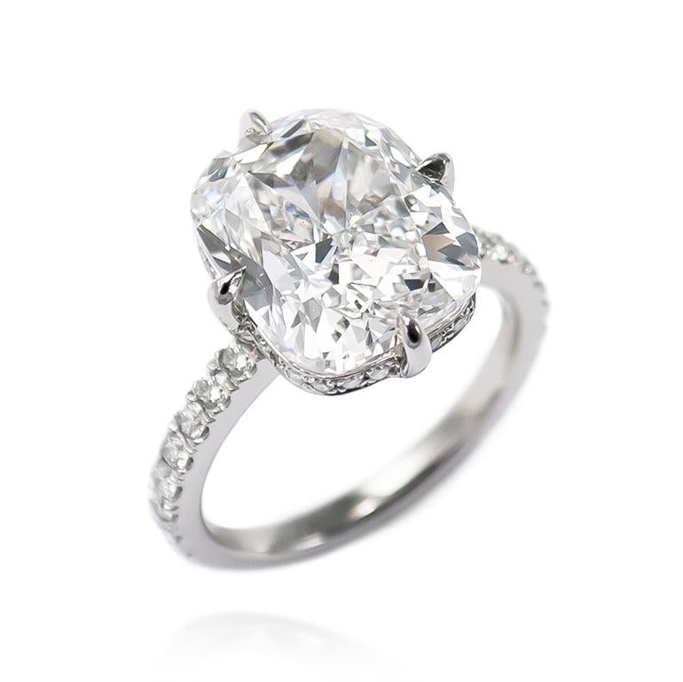 This brand new piece from the J. Birnbach workshop features a mesmerizing 7.22 carat cushion modified brilliant diamond certified by GIA to be J color and SI1 clarity. This beautifully elongated diamond is set in a handmade, platinum ring with pave