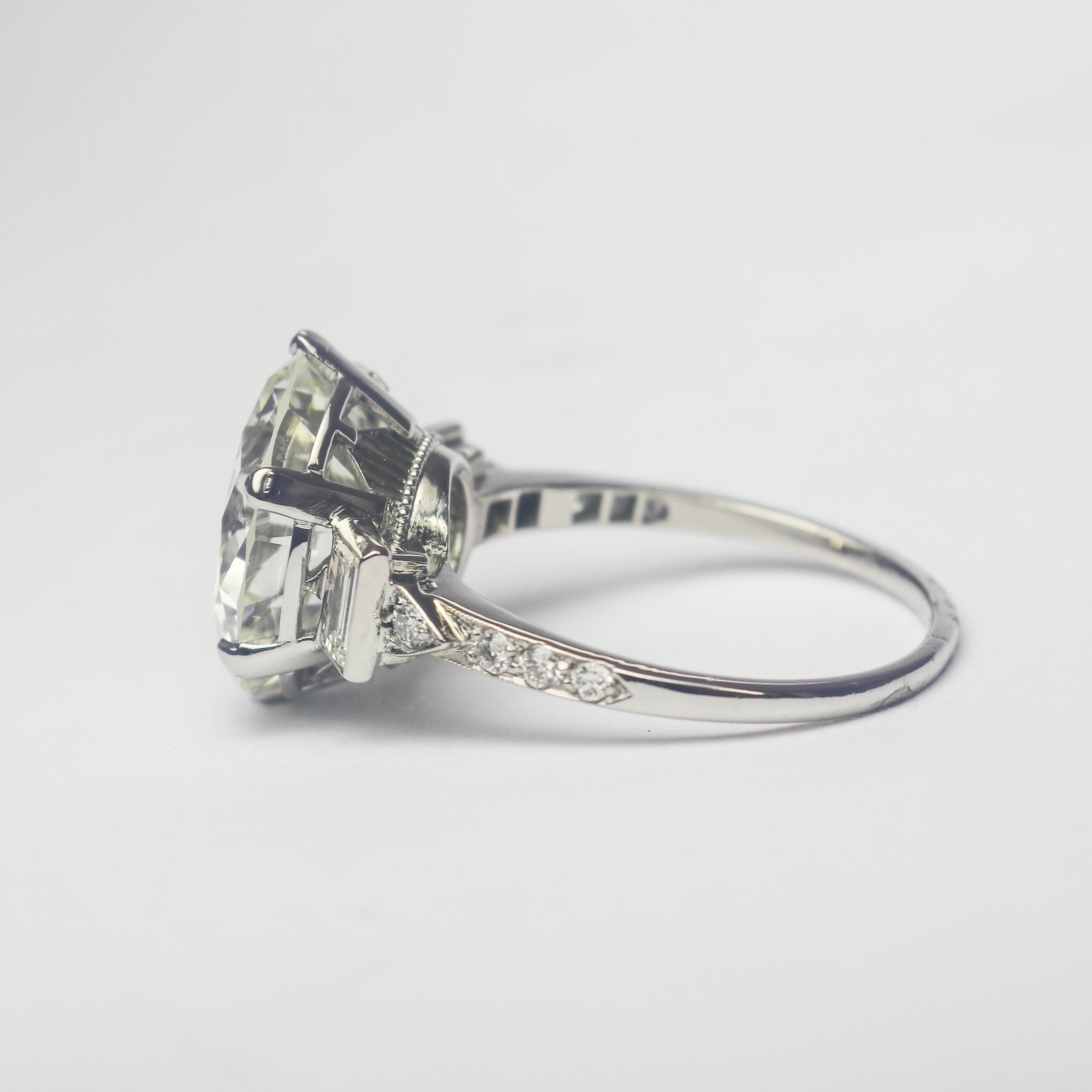 This exquisite, Art Deco style ring from the J. Birnbach workshop features a GIA certified 7.82 carat round brilliant cut diamond of J color and VS1 clarity as described by GIA grading report #5212515536. Set in a handmade, platinum ring with