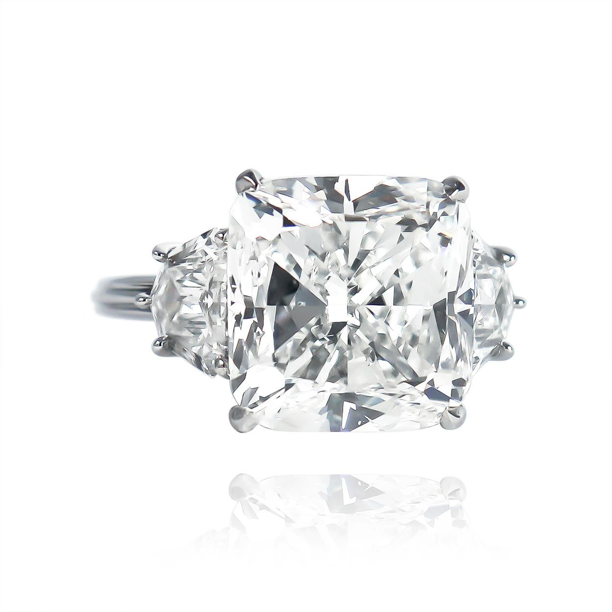 This J. Birnbach original features a 9.01 carat cushion modified brilliant cut diamond of H color and SI1 clarity... Fit for royalty, this stone is flanked by a pair of shield diamonds = 1.70 carat total weight. Beautifully cut and dispersive from