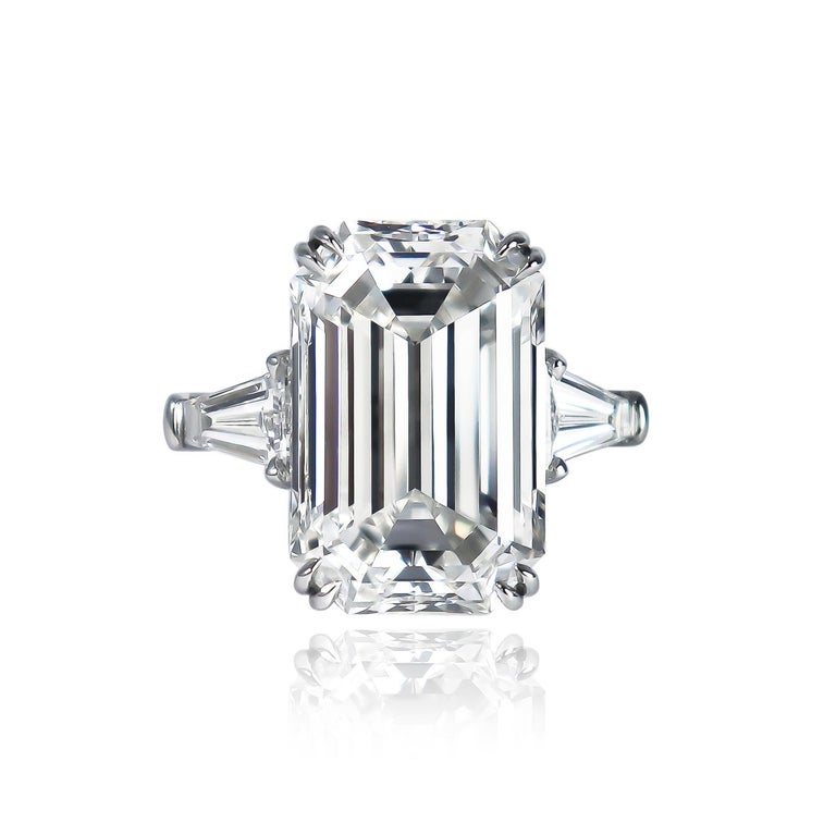 This ring fit for royalty is fresh from the J. Birnbach workshop! Featuring a GIA certified 9.23 carat emerald cut diamond of F color and VVS1 clarity, this center stone is thoughtfully set with a pair of beautifully tapered baguette side stones =