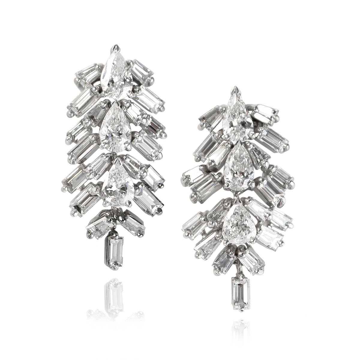 These scintillating, platinum drop earrings will be the new star of your jewelry collection! Featuring six pear shape diamonds = approximately 2.25 ctw and assorted straight / tapered baguettes, these earrings are a huge look for the price point!