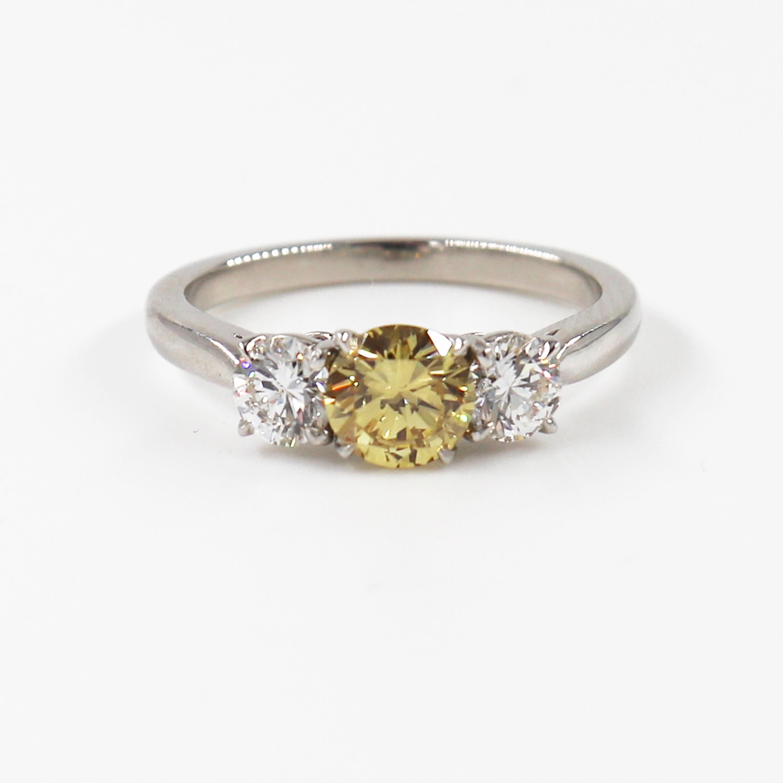 Modern J. Birnbach Fancy Intense 0.66 carat Yellow Round Diamond Three Stone Ring For Sale