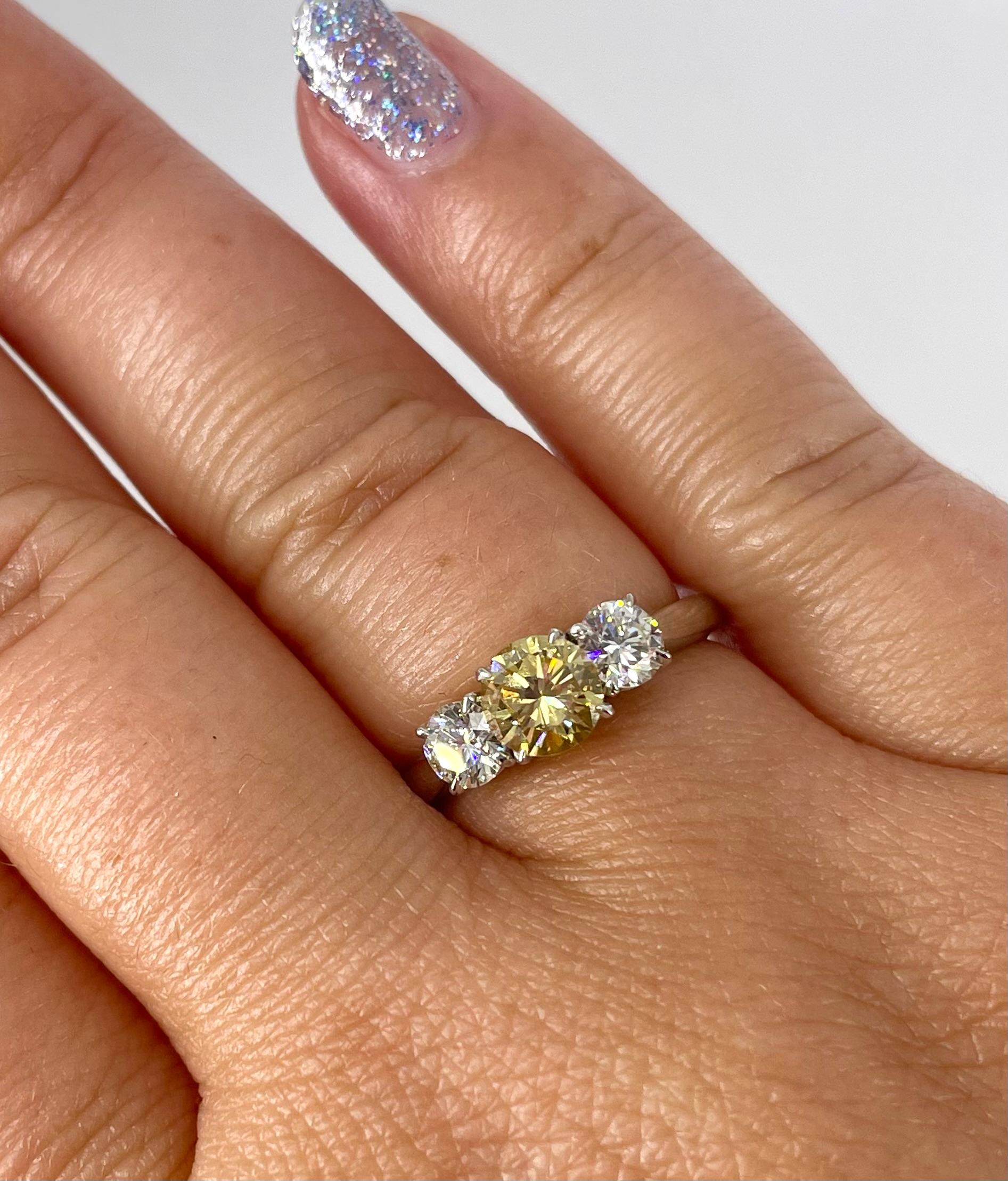 Women's J. Birnbach Fancy Intense 0.66 carat Yellow Round Diamond Three Stone Ring For Sale
